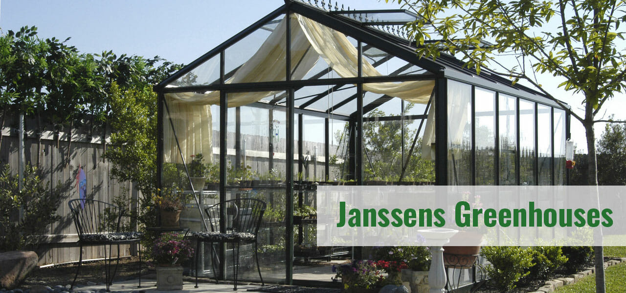Janssens glass greenhouse in a garden with the text: Janssens Greenhouses
