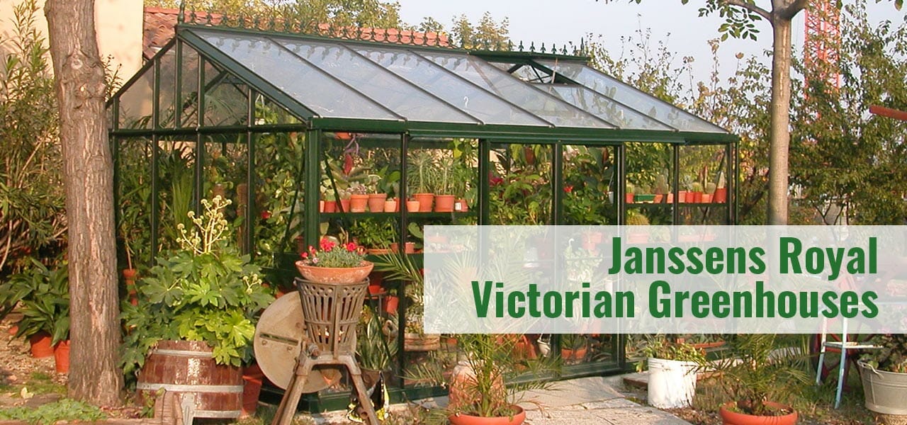 Green framed glass greenhouse in a garden setting with the text: Janssens Royal Victorian Greenhouses