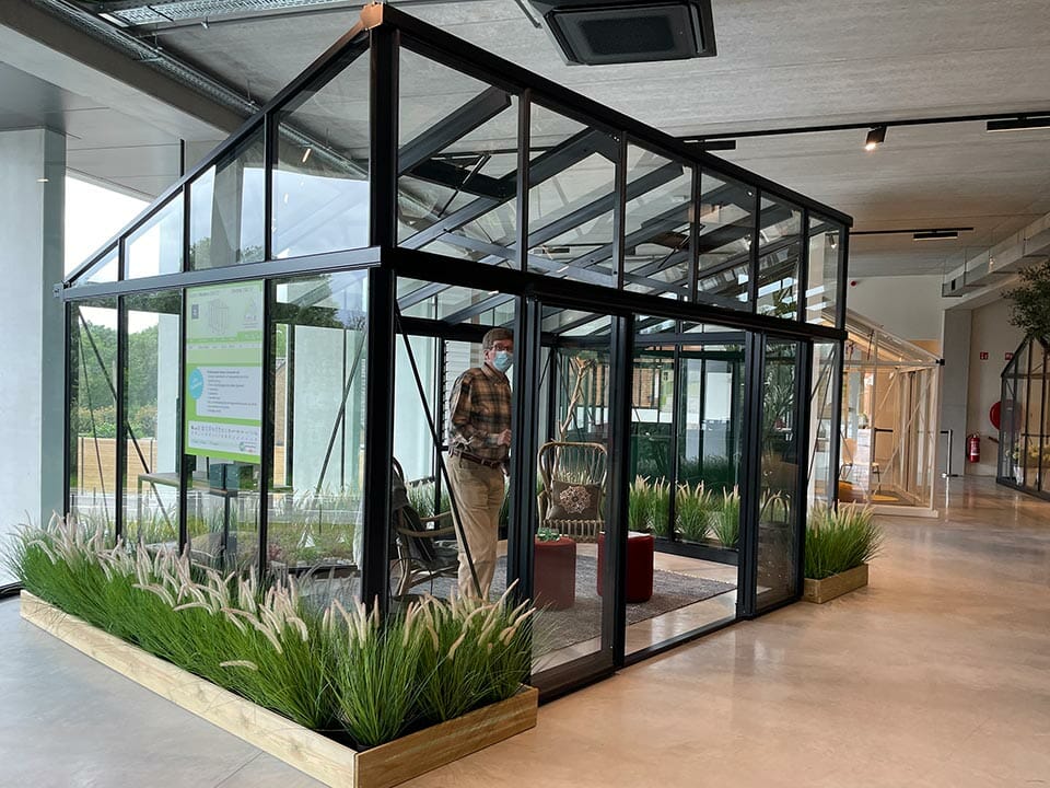 Janssens Modern Glass Greenhouse in a showroom