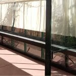 Interior view of greenhouse with shade cloths installed with text: Greenhouse Accessories Shade Cloths