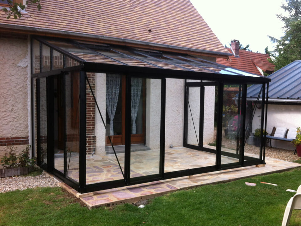 Front view of installed Janssens Arcadia Plus Lean-To Greenhouse, black frame