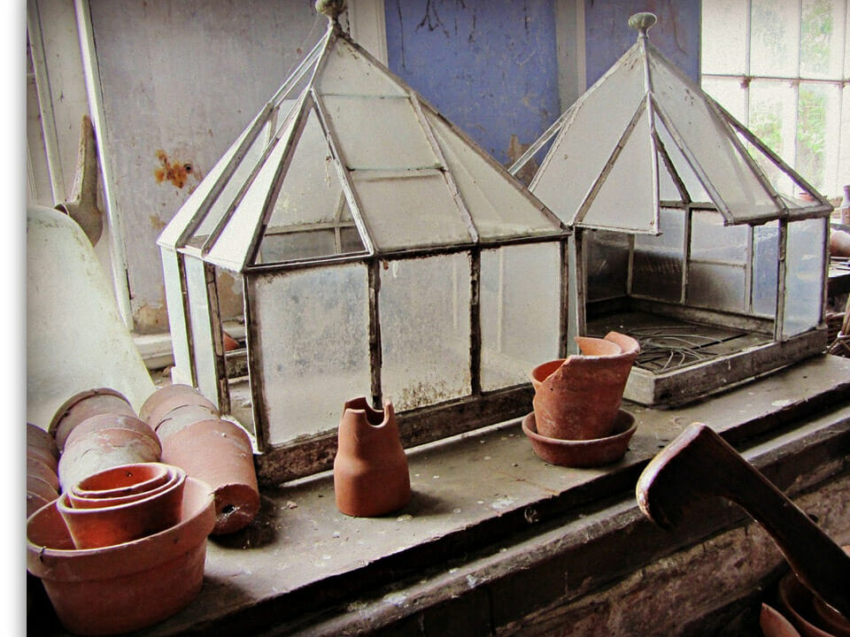 Plant cloches on a potting bench
