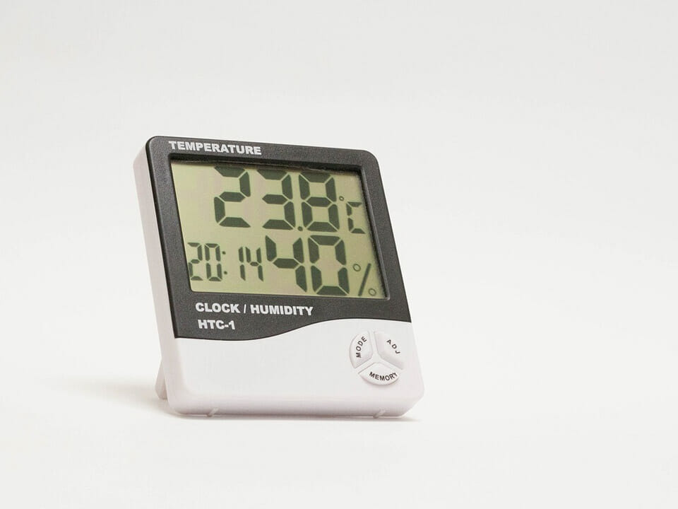 Digital thermometer with hygrometer shown on white background