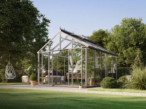 Exaco Livingten Glasshouse with dual pane glass in a backyard
