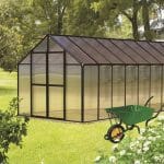 Greenhouse in open field with text: Maximizing Off-Grid Advantages with MONT Mojave Edition Greenhouses