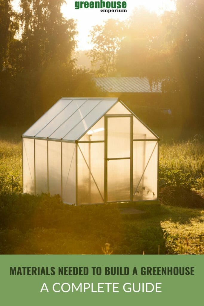 Greenhouse under the afternoon sun in a garden with the text: Materials Needed to Build a Greenhouse - A Complete Guide