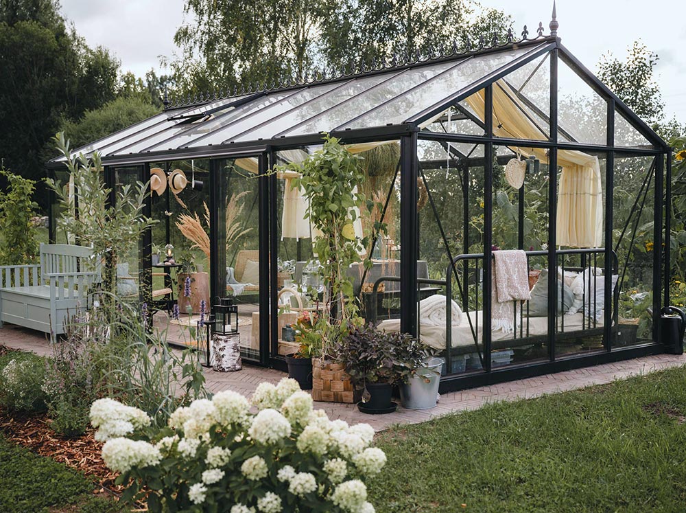 Elegant and stylish Exaco Janssens Royal Victorian VI36 Greenhouse in backyard