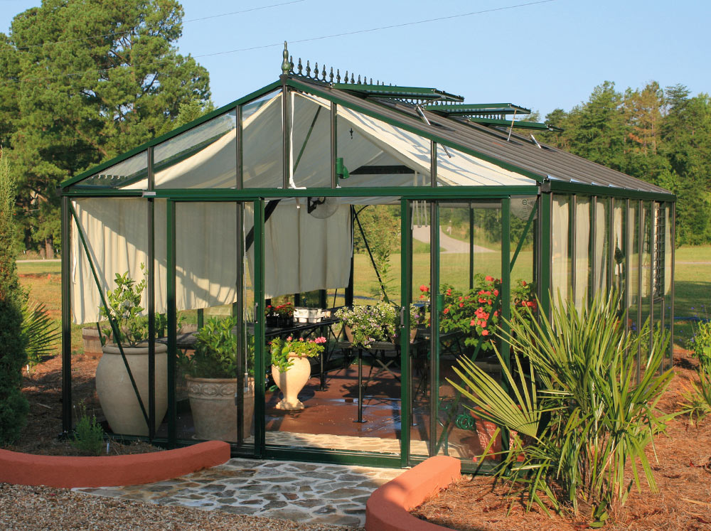 Exaco Janssens Royal Victorian VI46 Greenhouse with plants in a backyard
