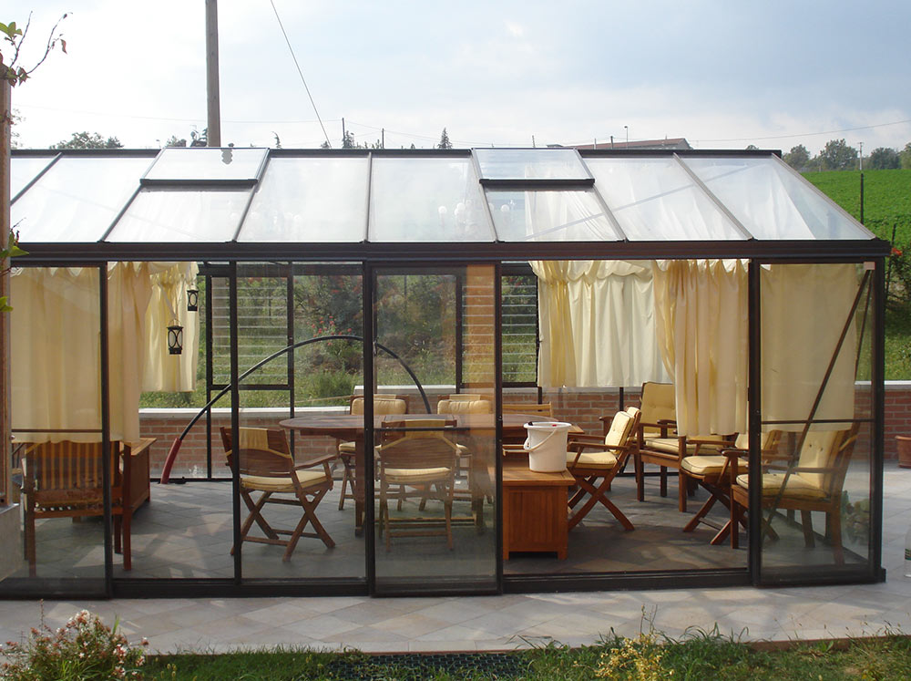 Exaco Janssens Royal Victorian VI46 Greenhouse with a big outdoor table and chairs