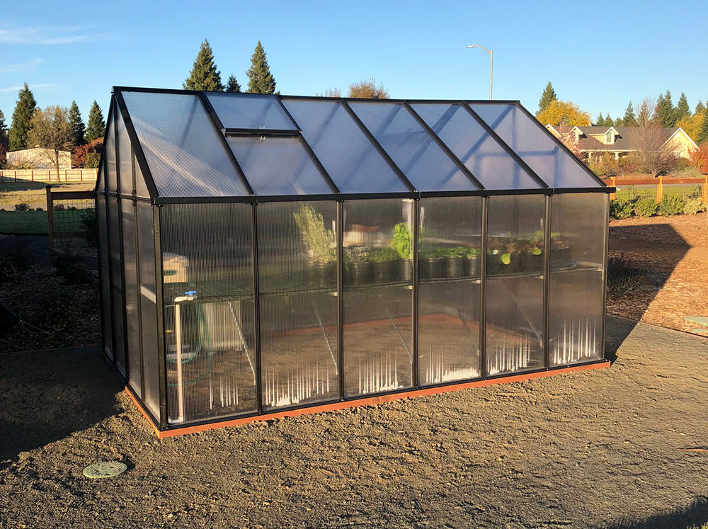 Side view of a Riverstone MONT Greenhouse 8x12