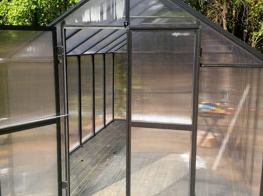 Front view of a Riverstone MONT Greenhouse