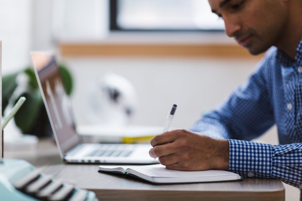 Man working on permit for greenhouse business on computer