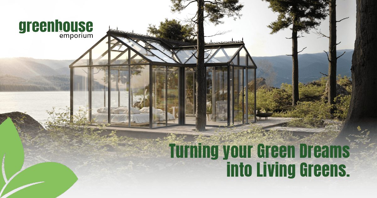 Beautiful glass greenhouse by a lake with the Greenhouse Emporium Logo and the text: Turning your Green Dreams into Living Greens.