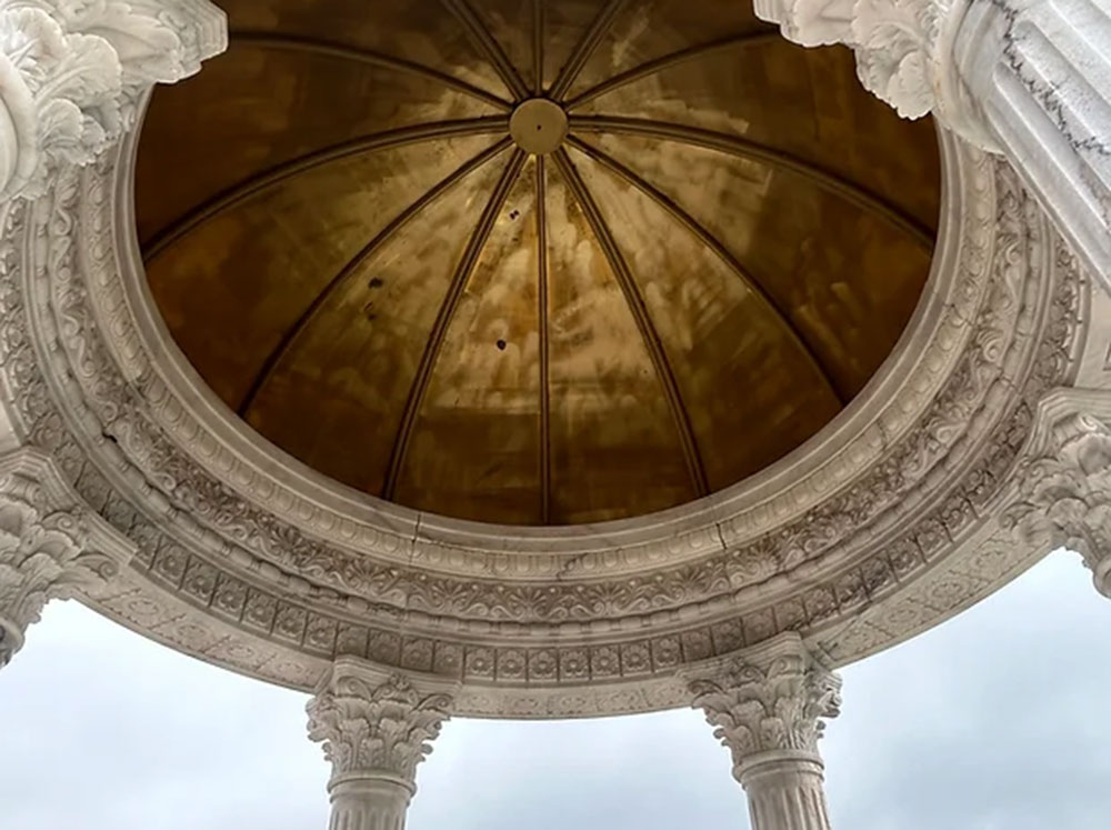 Carved details on the bottom of a Victorian Marble Gazebo with copper dome