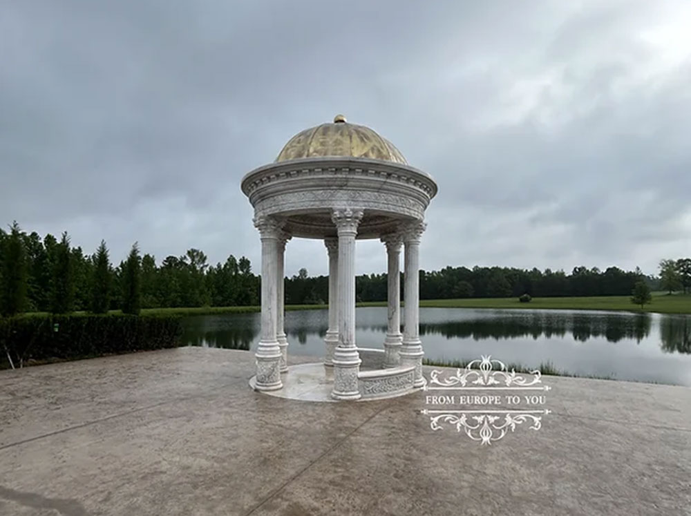 Beautifully carved Victorian Marble Gazebo next to a pond