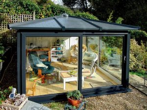 Madison Nordic Garden Room with furniture inside in a backyard