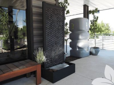 73" tall, textured, black laguna wall fountain with 33” W x 18” D x 10” H rectangle pool base. Made of natural lava stone and aluminum, uses a 608 GPH pump to create a "falls" effect, and weighs 328 lbs.