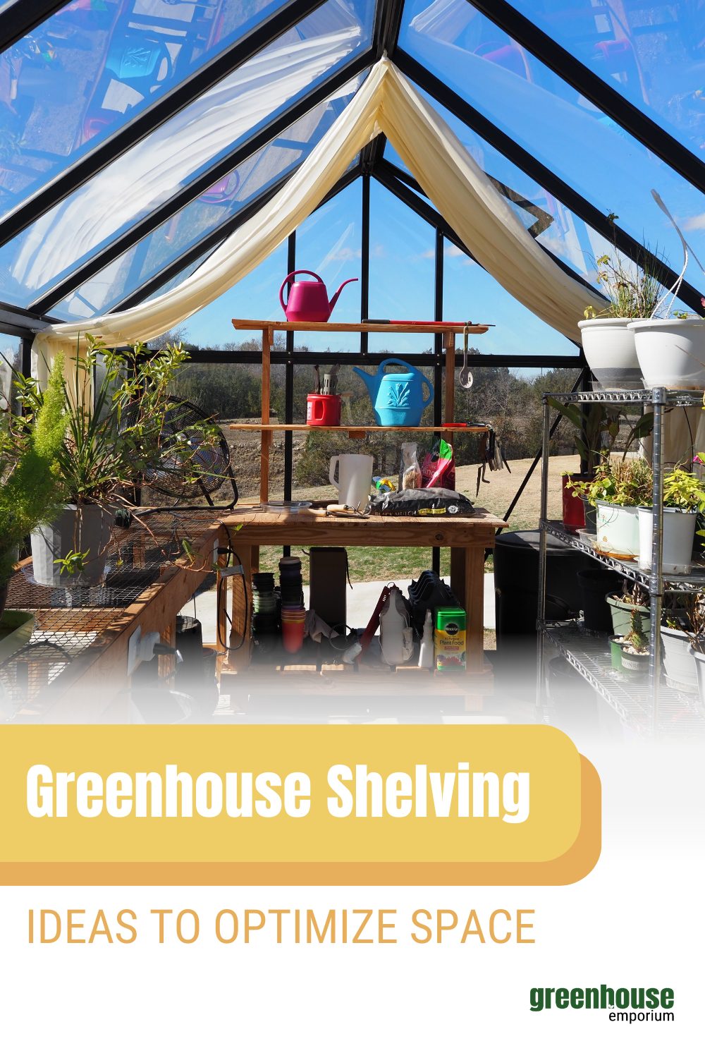Interior of a glass greenhouse with many different kinds of space saving greenhouse shelving.