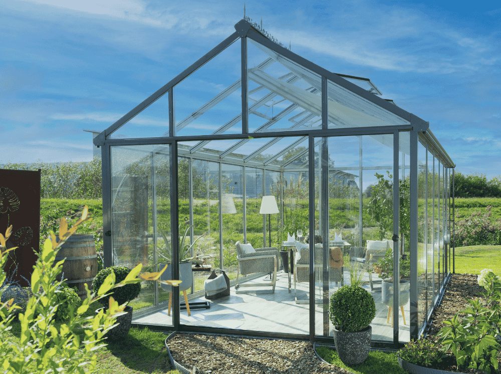 Best insulated glass greenhouse - the large Livingten glass greenhouse set in a backyard