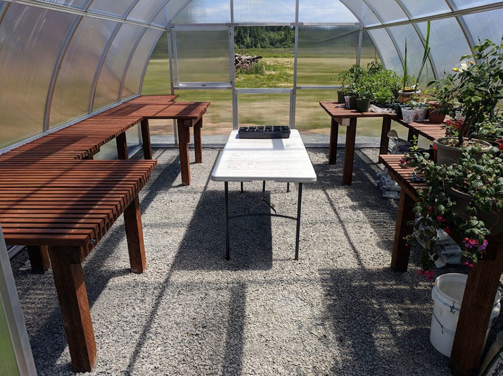 The inside of a Riga polycarbonate greenhouse cleaned up in preparation for winter. 