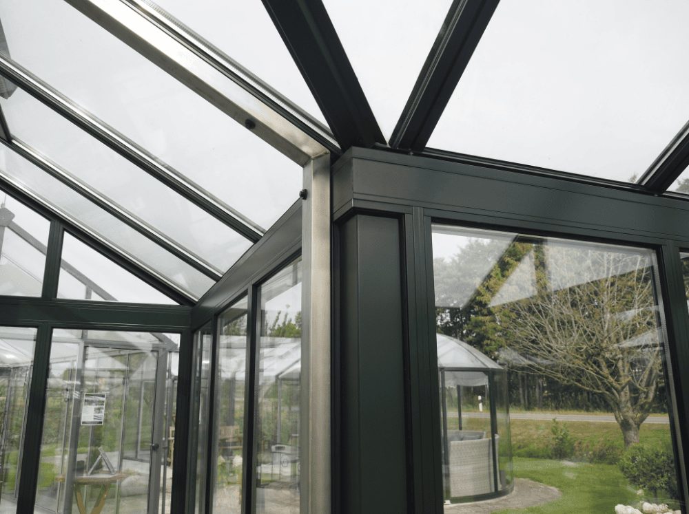 Close up of Hoklartherm Glass Greenhouse York Insulated T-shaped interior supports 