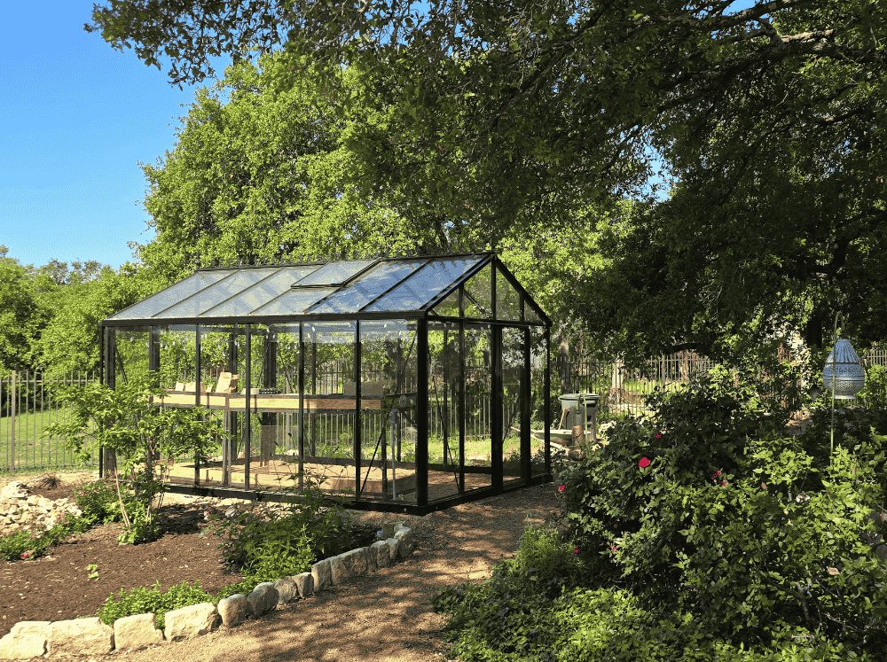 External view of a glass Royal Victorian glass greenhouse