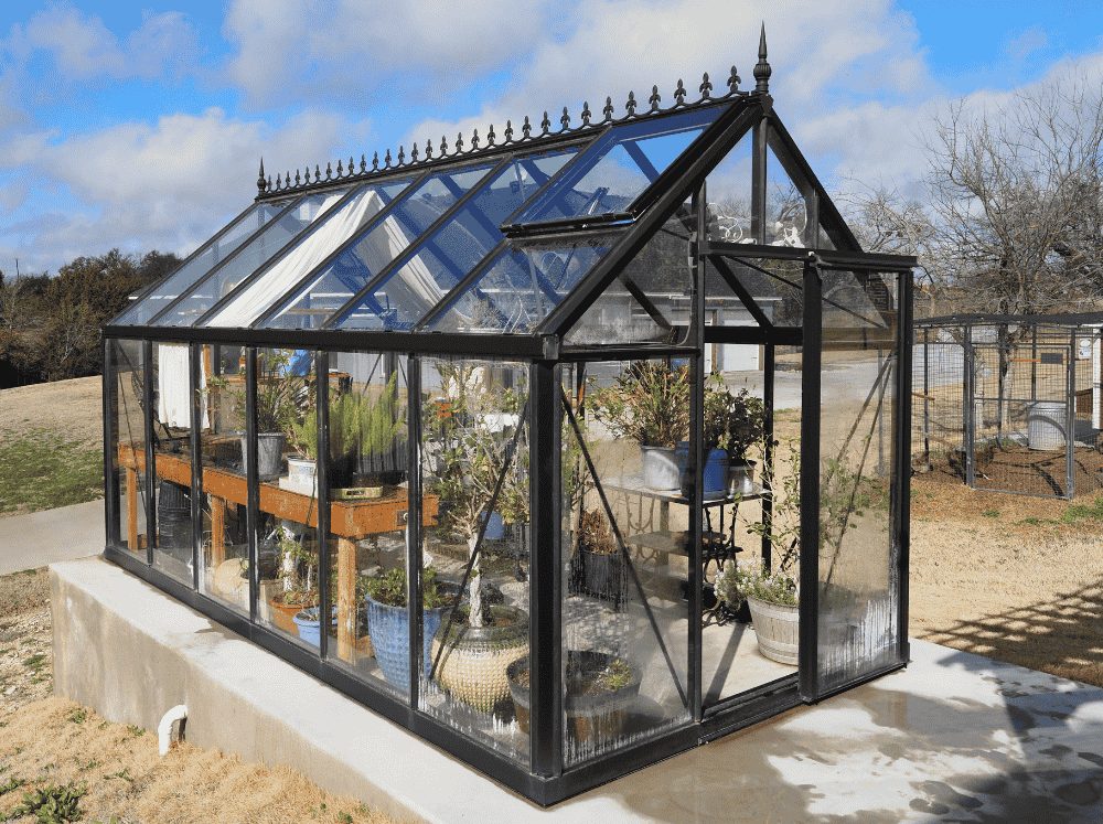 External view of a glass Royal Victorian glass greenhouse