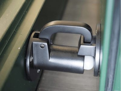 Close up profile of hinged door stop closed.